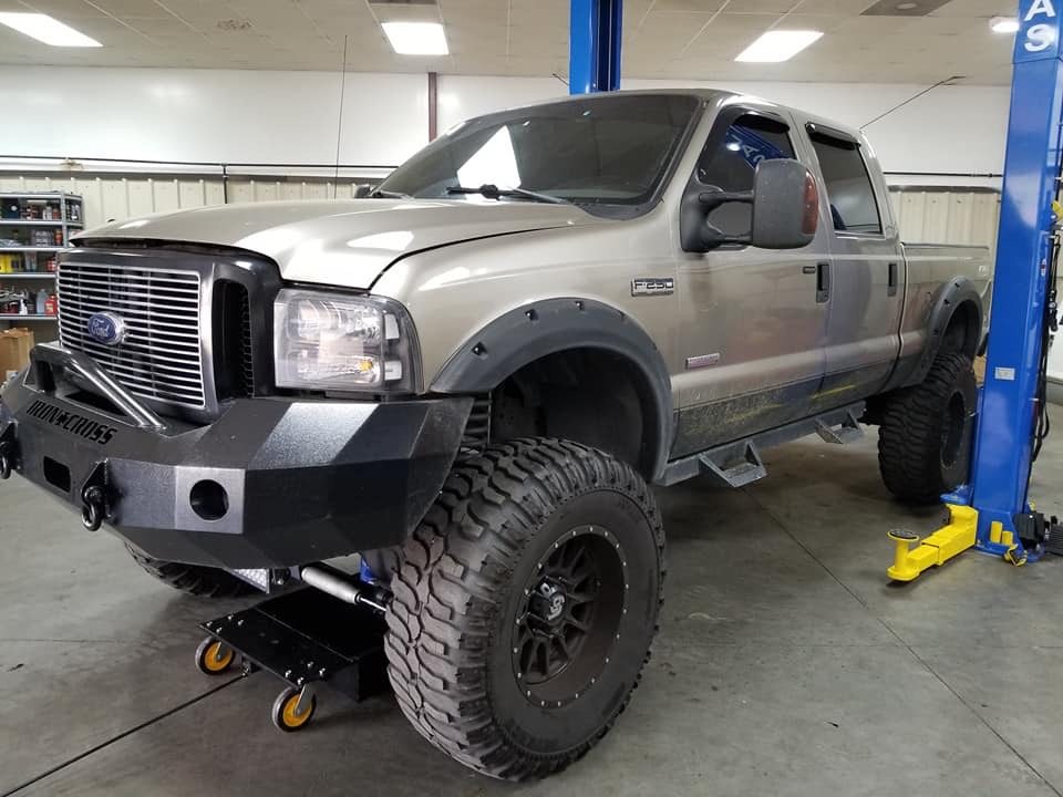 Lifted Ford Super Duty in the Economy Diesel shop